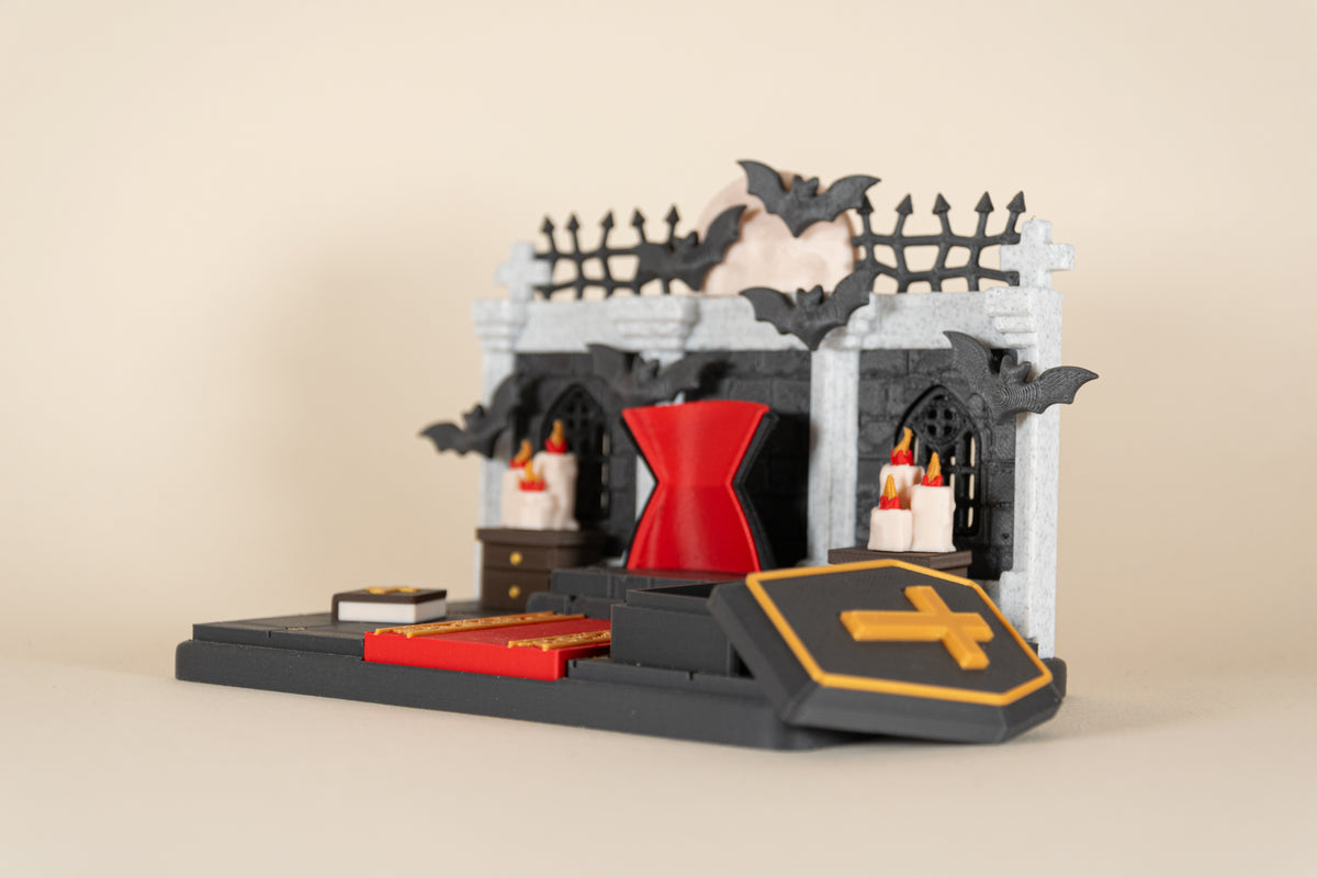 Le Repaire de Dracula MinoZoo avec couvercle du cercueil amovible placé devant la scène.
