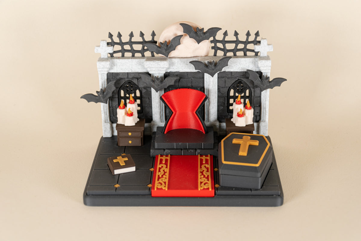 Le Repaire de Dracula MinoZoo vu de dessus, avec trône, tapis rouge, livre et cercueil.